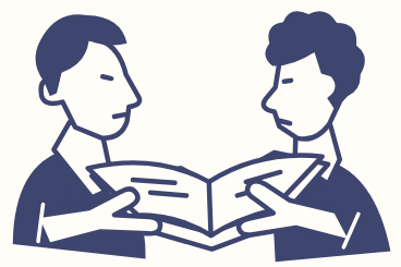 Two people finding their place together in a prayer book
